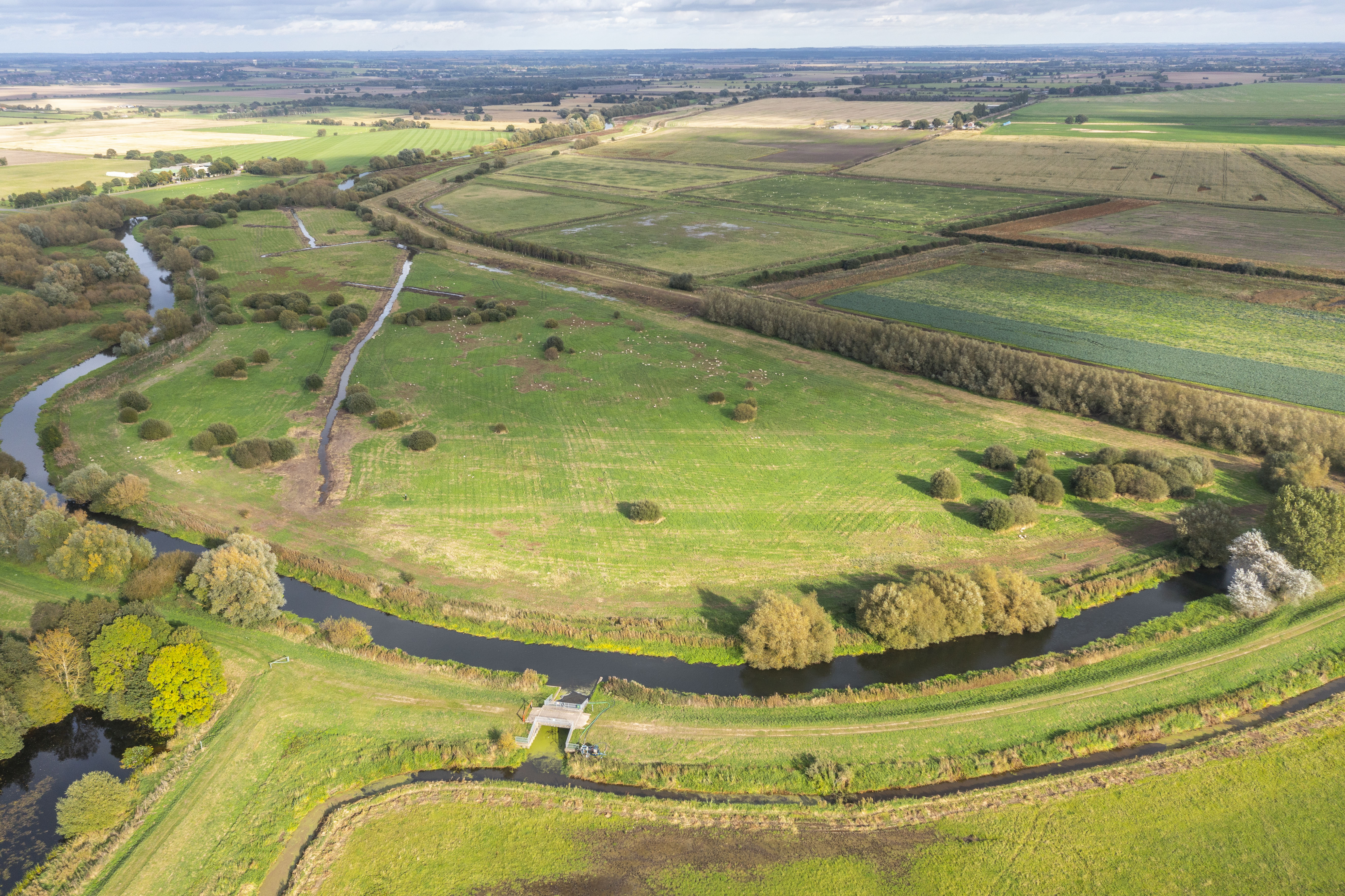 An aerial image of the SSSI showing various watercourses and walkways, vegetation and agricultural land.