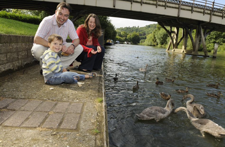 Image of a family feeding ducks at Goring on the river Thames