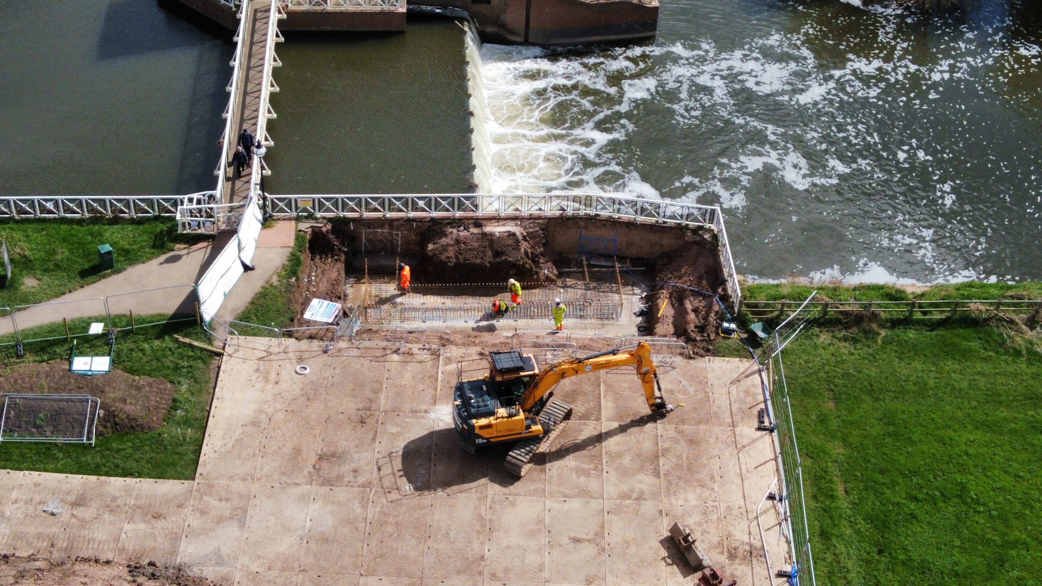 Closer aerial view of construction site next to sluice